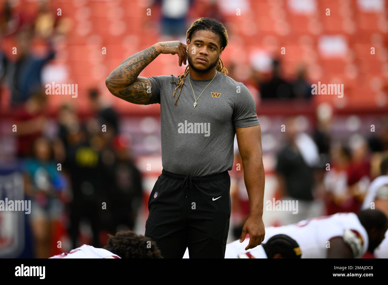 Washington Commanders defensive end Chase Young looks on before a NFL ...