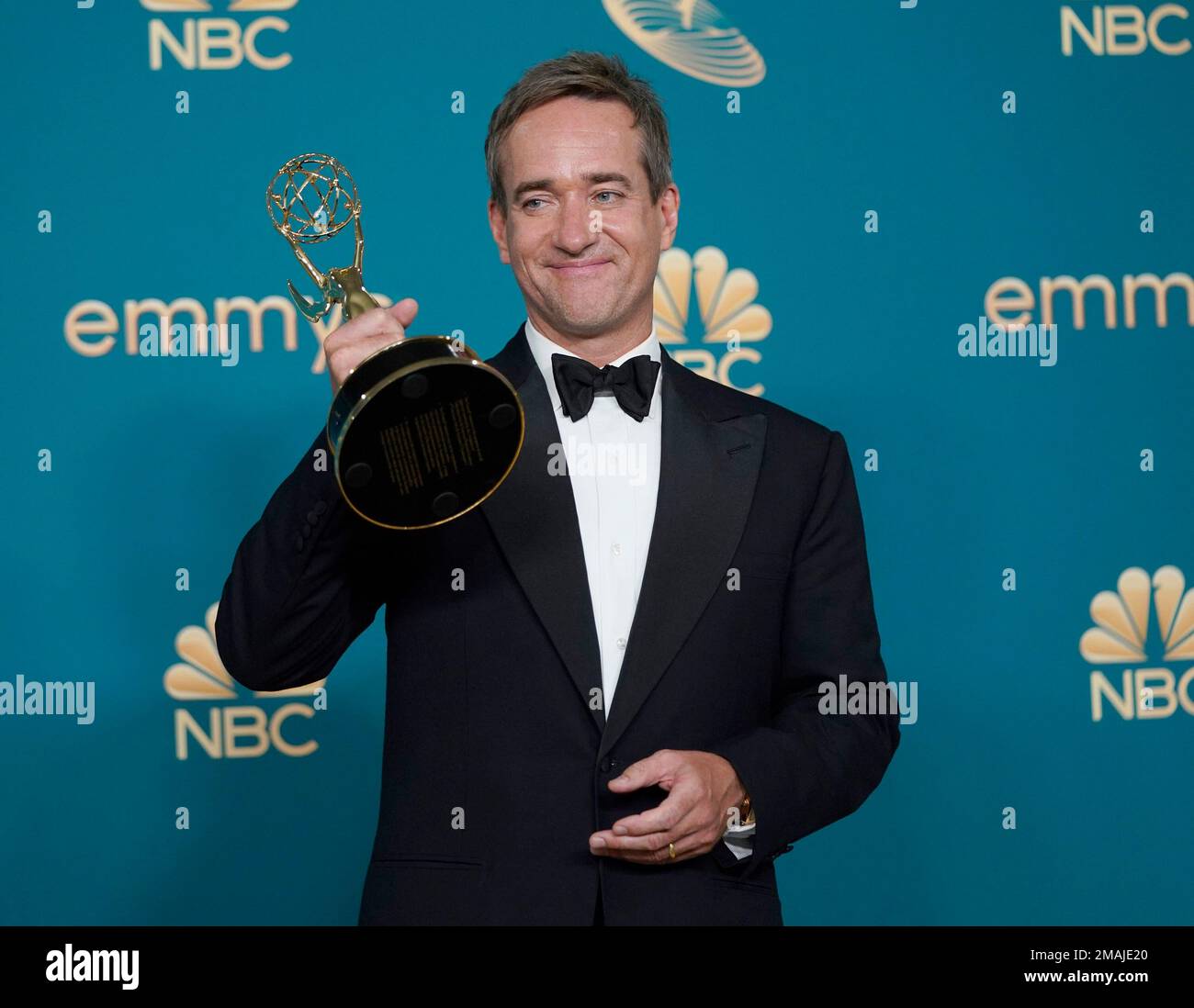 Matthew Macfadyen poses in the press room with the award for
