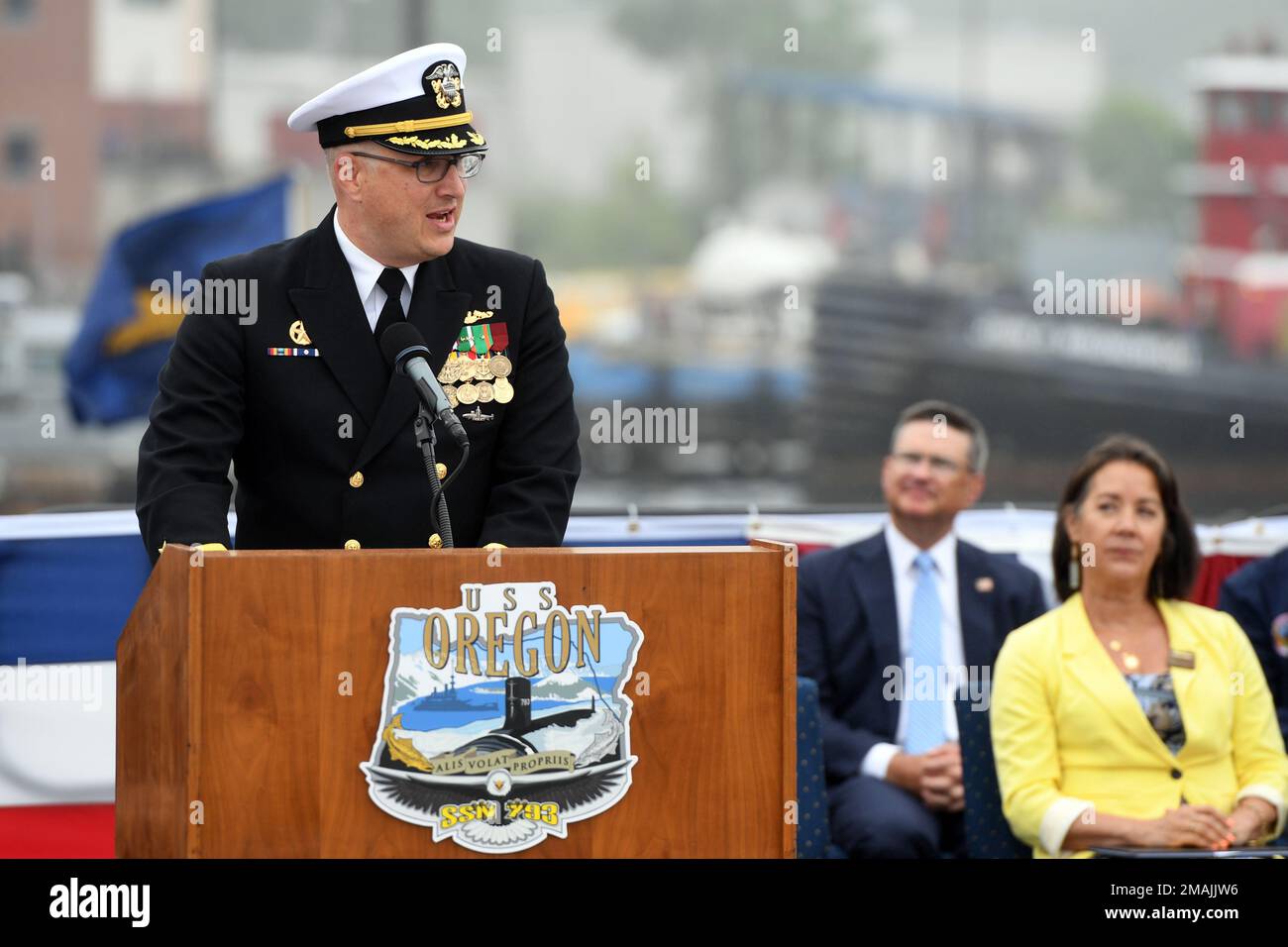 220528-N-GR655-0186 GROTON, Connecticut (May 28, 2022) – Cmdr. Lacy Lodmell, commanding officer of the Virginia-class fast attack submarine USS Oregon (SSN 793), delivers remarks during a commissioning ceremony in Groton, Connecticut May 28, 2022. SSN 793, the third U.S Navy ship launched with the name Oregon and first in more than a century, is a flexible, multi-mission platform designed to carry out the seven core competencies of the submarine force: anti-submarine warfare; anti-surface warfare; delivery of special operations forces; strike warfare; irregular warfare; intelligence, surveilla Stock Photo