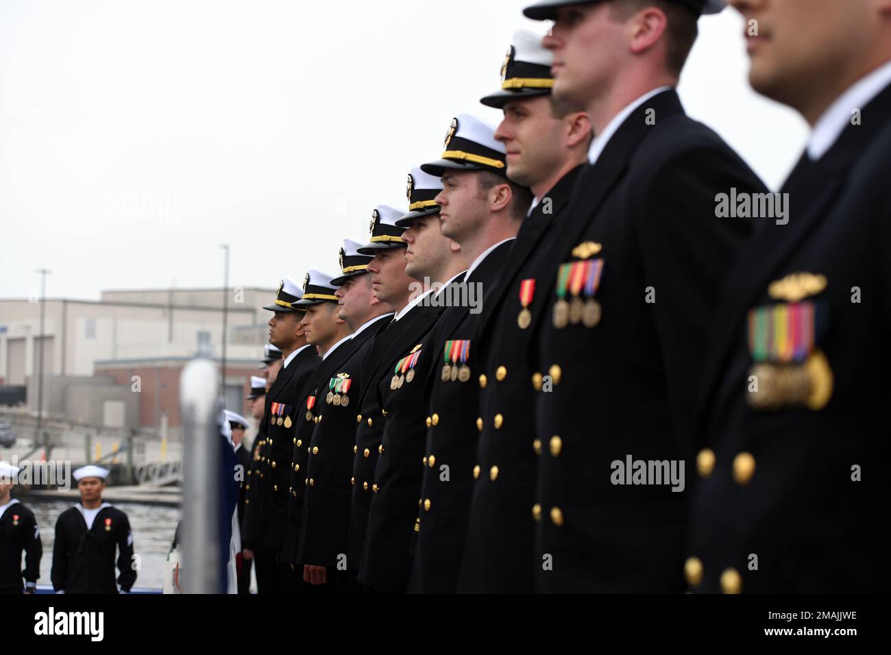 220528-N-GR655-0164 GROTON, Connecticut (May 28, 2022) – Crewmembers attached to the Virginia-class fast attack submarine USS Oregon (SSN 793) man the brow during a commissioning ceremony in Groton, Conn., May 28, 2022. SSN 793, the third U.S Navy ship launched with the name Oregon and first in more than a century, is a flexible, multi-mission platform designed to carry out the seven core competencies of the submarine force: anti-submarine warfare; anti-surface warfare; delivery of special operations forces; strike warfare; irregular warfare; intelligence, surveillance and reconnaissance; and Stock Photo