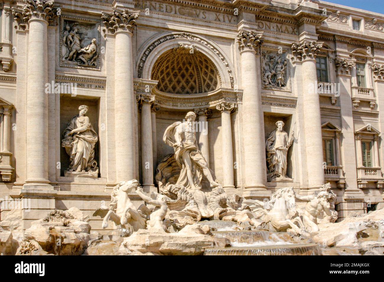 The Trevi Fountain in Rome on a bright sunny day made of travertine stone. Stock Photo