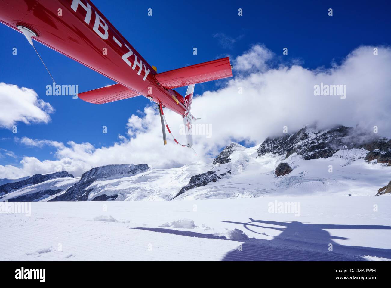 Helicopter tail with back rotor. behind in background is the Jungfrau ...
