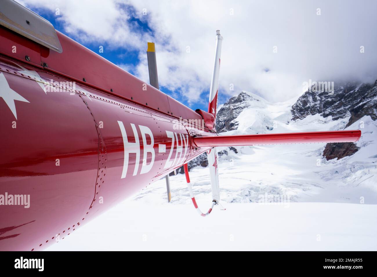 Helicopter tail with back rotor. behind in background is the Jungfrau ...