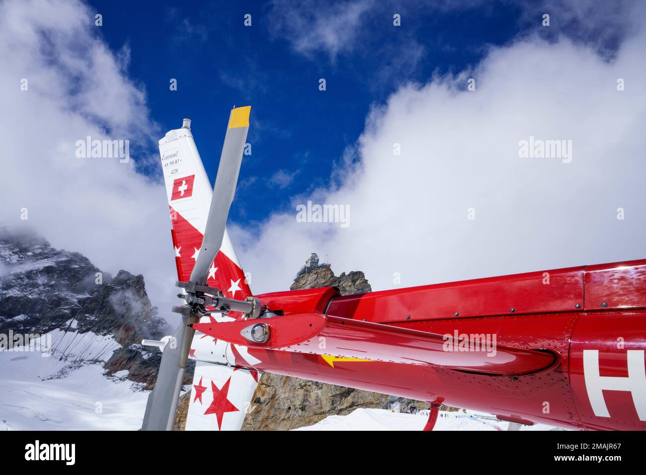 Helicopter tail with back rotor. behind in background is the Jungfrau ...