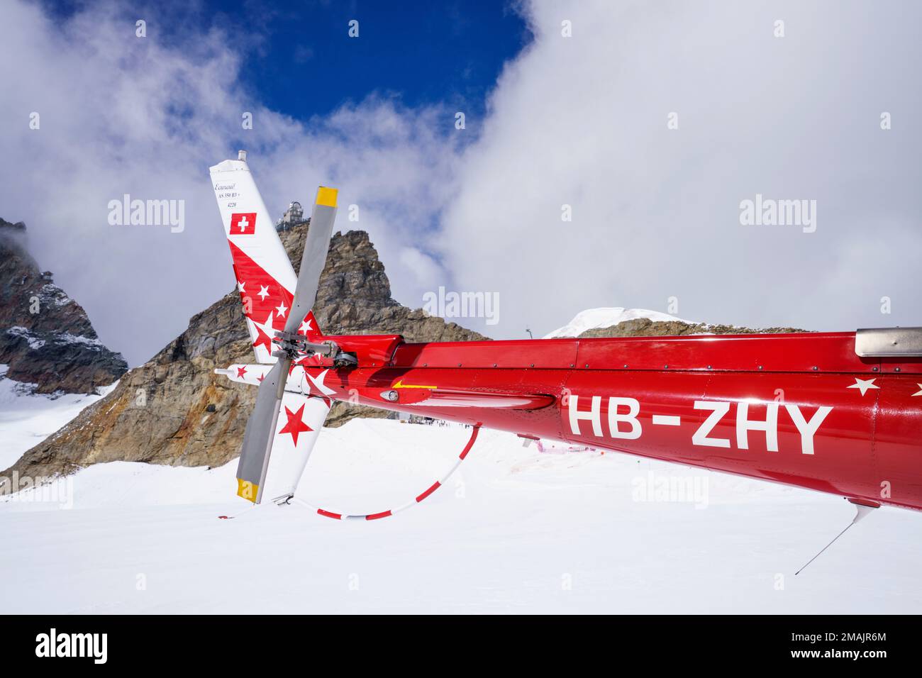Helicopter tail with back rotor. behind in background is the Jungfrau ...