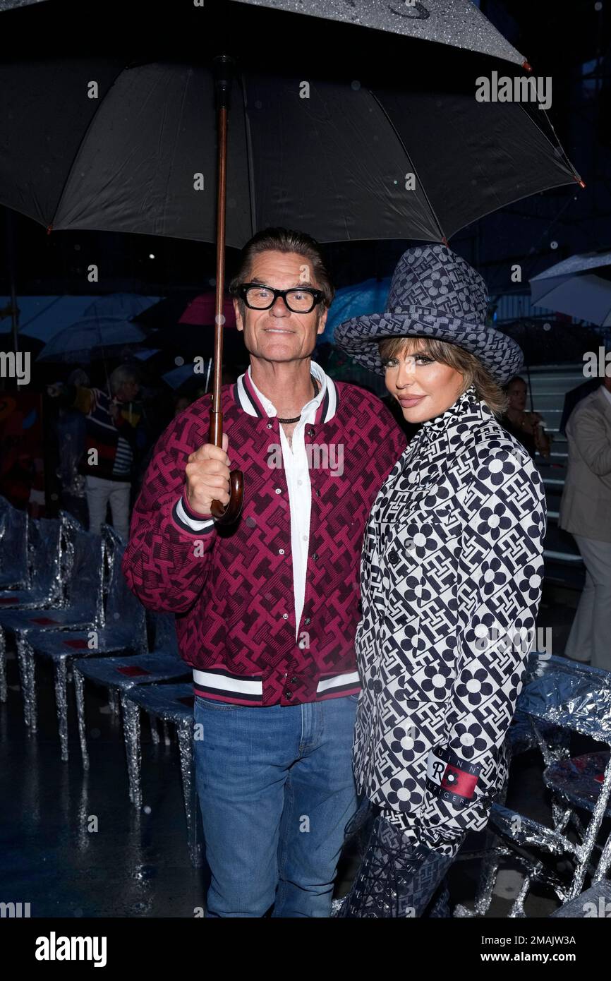 Harry Hamlin, left, and Lisa Rinna attend the Tommy Hilfiger Fall 2022  fashion show at the Skyline Drive-In on Sunday, Sept. 11, 2022, in New  York. (Photo by Charles Sykes/Invision/AP Stock Photo -