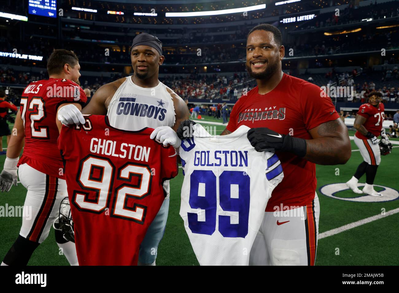 Dallas Cowboys defensive end Chauncey Golston, left, and Tampa Bay  Buccaneers defensive end William Gholston, right, exchange jerseys after  their team's NFL football game in Arlington, Texas, Sunday, Sept. 11, 2022.  (AP