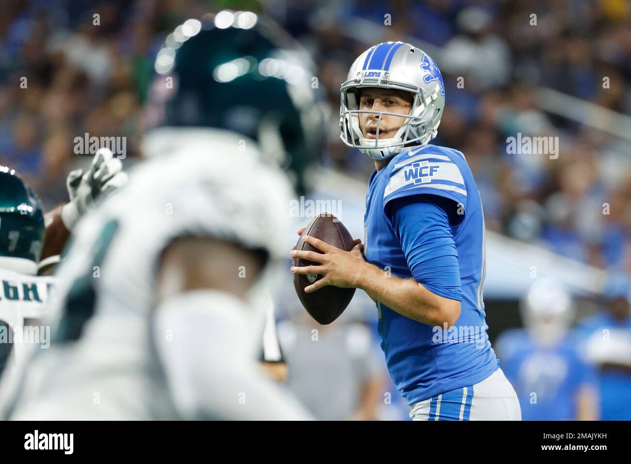 Detroit Lions quarterback Jared Goff (16) drops back to pass in the