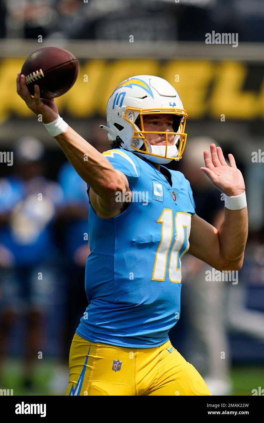 Los Angeles Chargers quarterback Justin Herbert (10) warms up before an