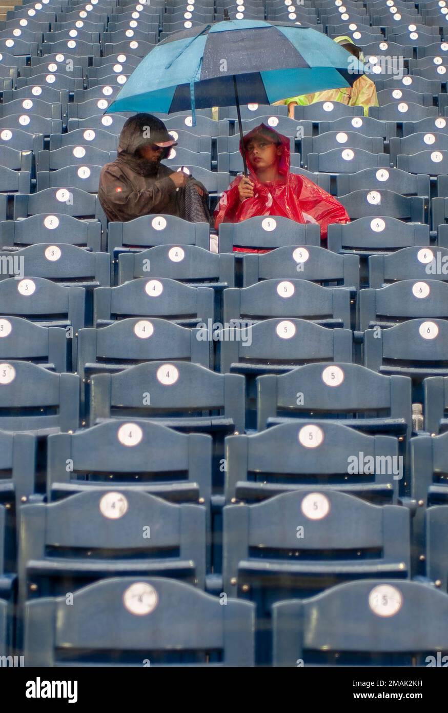 Fans wait out a rain delay after the second inning of a baseball game  between the Philadelphia Phillies and the Washington Nationals, Sunday,  Sept. 11, 2022, in Philadelphia. (AP Photo/Laurence Kesterson Stock