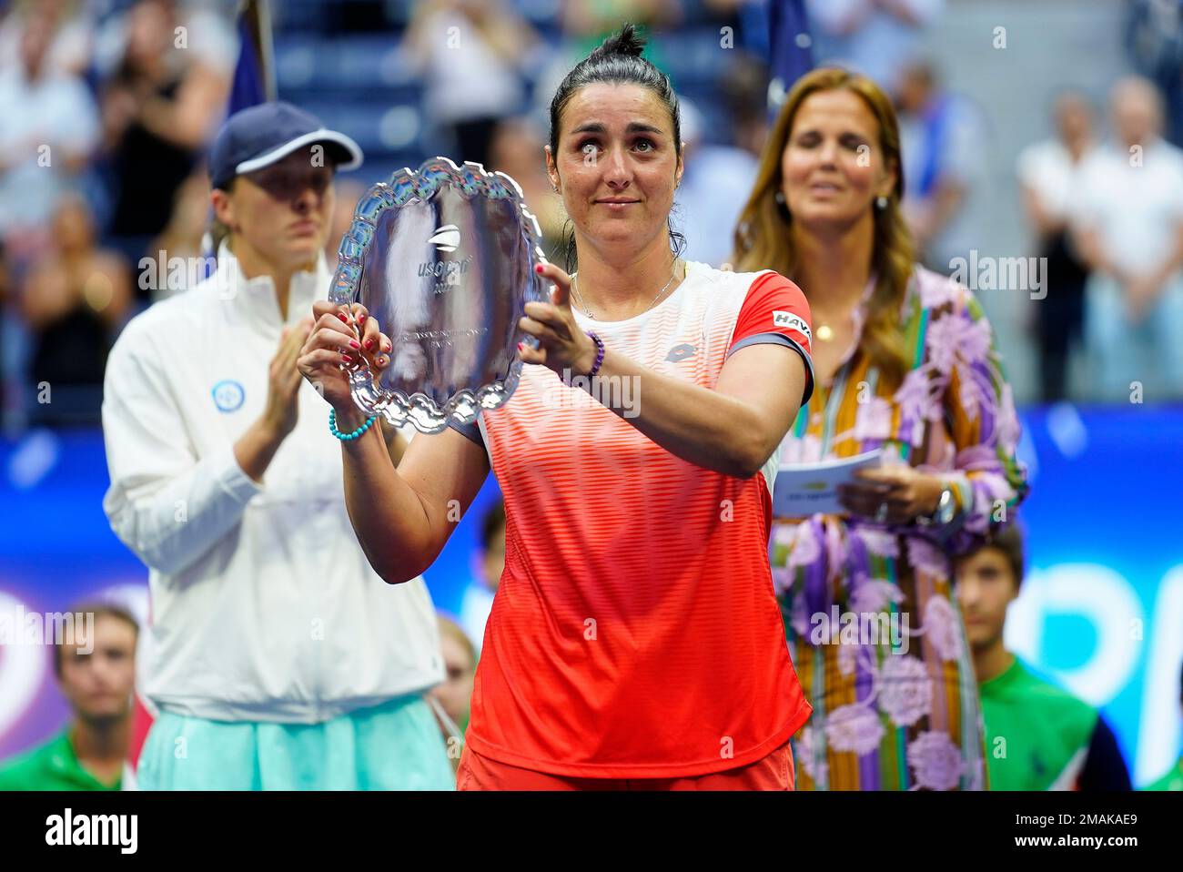 Ons Jabeur, of Tunisia, holds up the runner up trophy after losing to Iga Swiatek, of Poland, during the womens singles final of the U.S