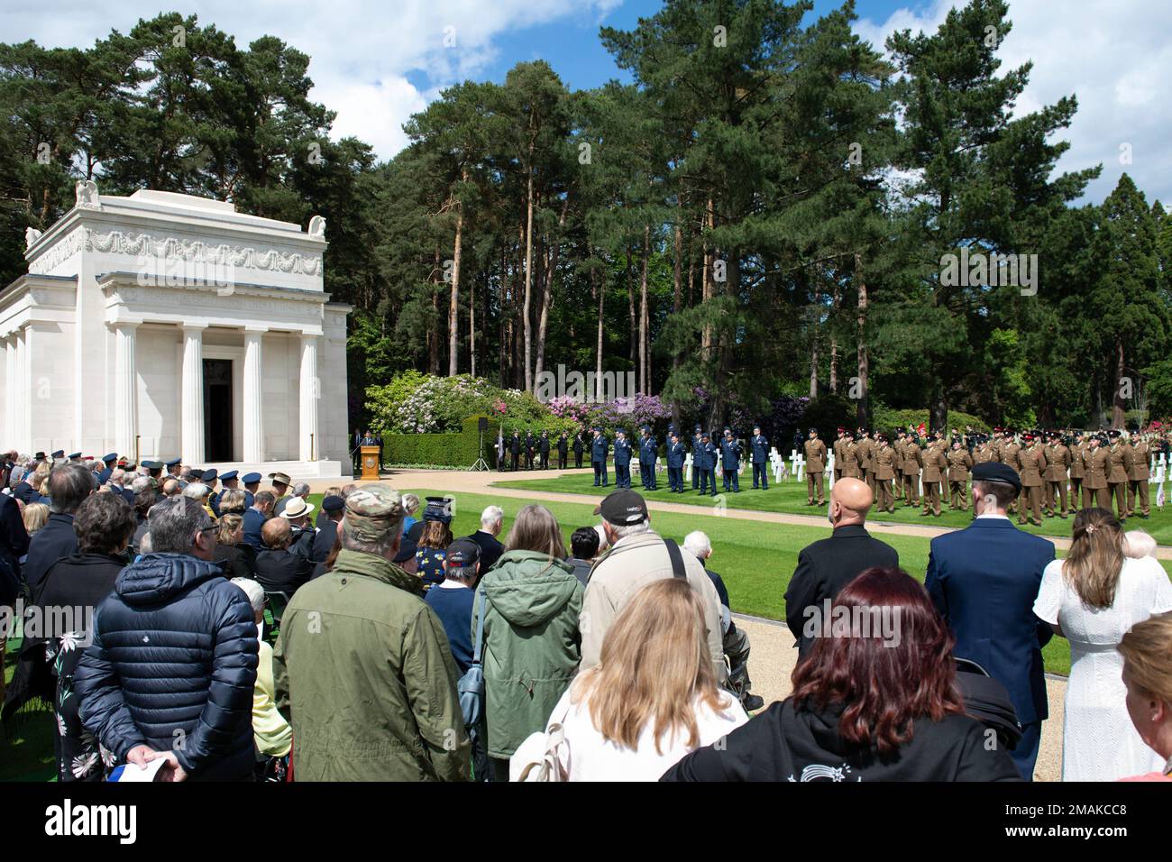 Armed Forces and guests gather for a Memorial Day ceremony at the Brookwood American Military Cemetery, England, May 29, 2022. Memorial Day provides us a solemn opportunity to remember our fallen brothers and sisters in arms, reflect upon their courageous sacrifice, and show gratitude for the freedom they gave their lives to defend. It also affords us the opportunity to pay homage to those families who lost their loved ones in service to the Nation-and continue to feel the full weight of that sacrifice today. Stock Photo