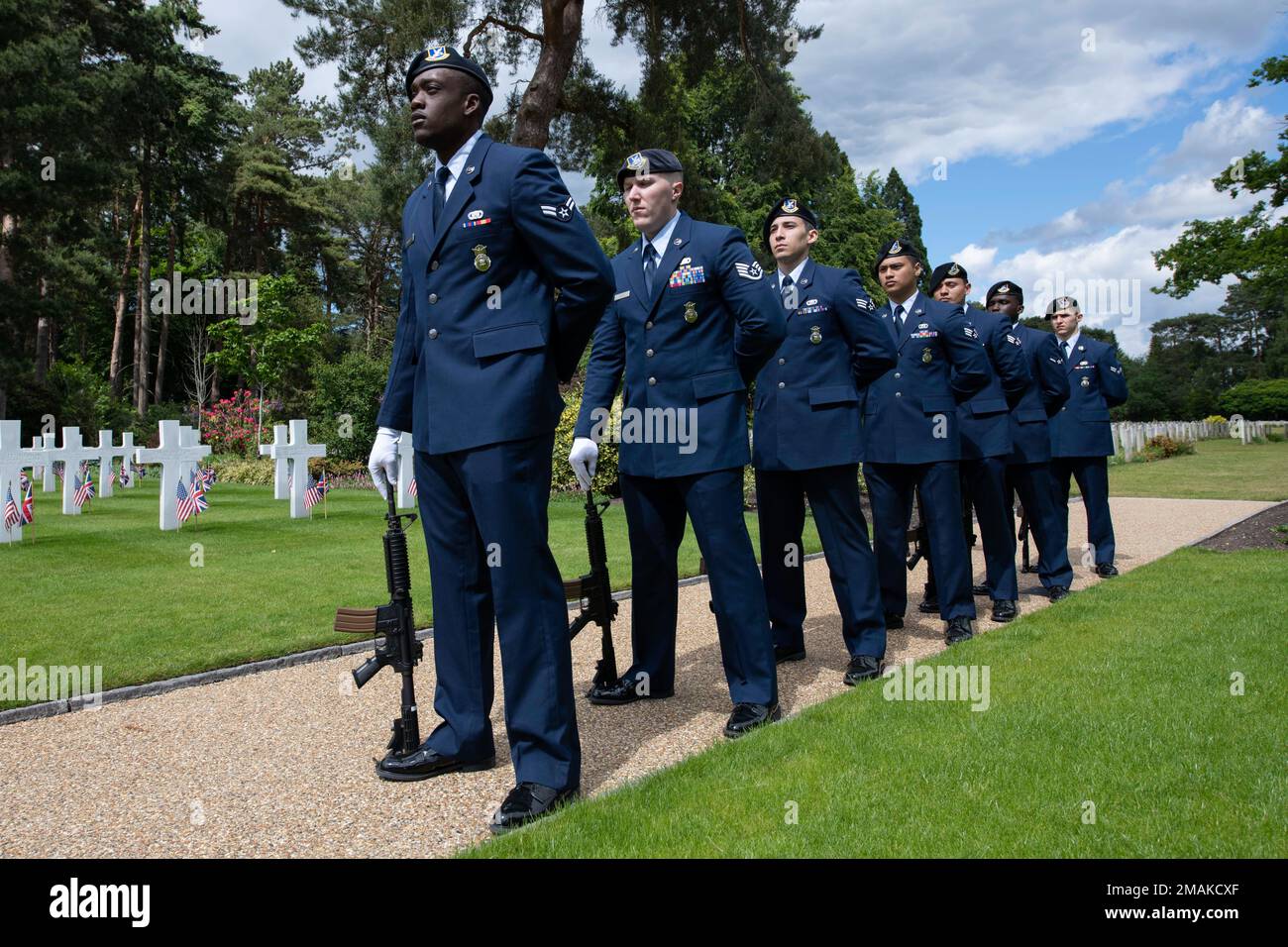 U.S. Air Force 422nd Security Forces Squadron Defenders prepare to perform a 21-gun salute during a Memorial Day ceremony at the Brookwood American Military Cemetery, England, May 29, 2022. Memorial Day provides us a solemn opportunity to remember our fallen brothers and sisters in arms, reflect upon their courageous sacrifice, and show gratitude for the freedom they gave their lives to defend. It also affords us the opportunity to pay homage to those families who lost their loved ones in service to the Nation-and continue to feel the full weight of that sacrifice today. Stock Photo