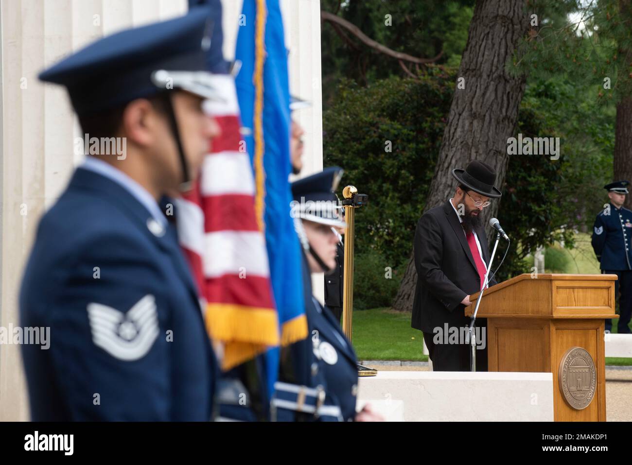 Rabbi Yechezkel Mandelbaum, right, Rabbi of Kingston, Surbiton and District United Synagogue, leads an invocation during a Memorial Day ceremony at the Brookwood American Cemetery, England, May 29, 2022. Memorial Day provides us a solemn opportunity to remember our fallen brothers and sisters in arms, reflect upon their courageous sacrifice, and show gratitude for the freedom they gave their lives to defend. It also affords us the opportunity to pay homage to those families who lost their loved ones in service to the Nation-and continue to feel the full weight of that sacrifice today. Stock Photo