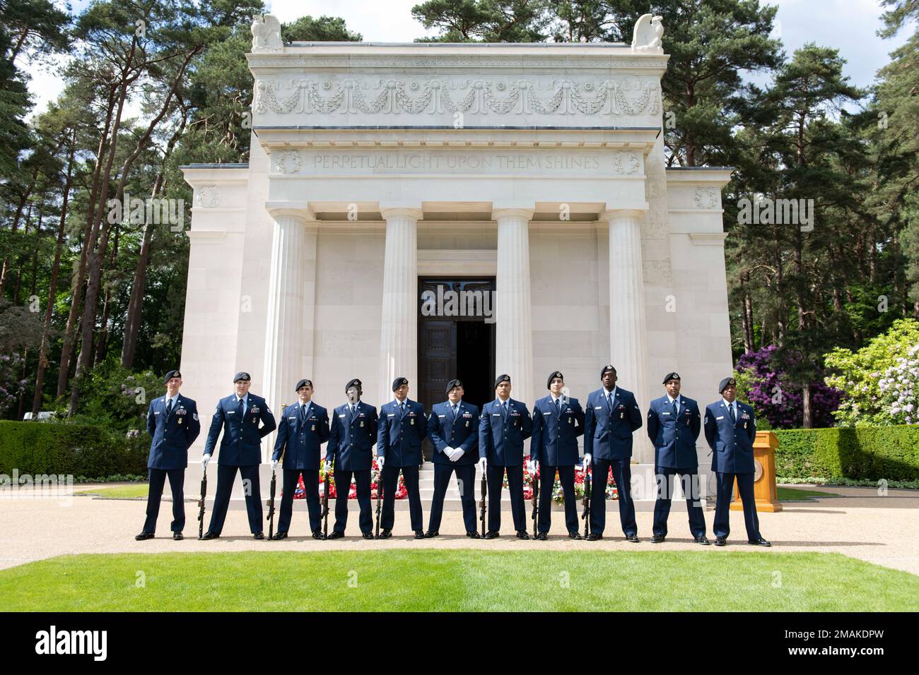 U.S. Air Force 422nd Security Forces Squadron Defenders pose for a group photo after a Memorial Day ceremony at the Brookwood American Cemetery, England, May 29, 2022. Memorial Day provides us a solemn opportunity to remember our fallen brothers and sisters in arms, reflect upon their courageous sacrifice, and show gratitude for the freedom they gave their lives to defend. It also affords us the opportunity to pay homage to those families who lost their loved ones in service to the Nation-and continue to feel the full weight of that sacrifice today. Stock Photo