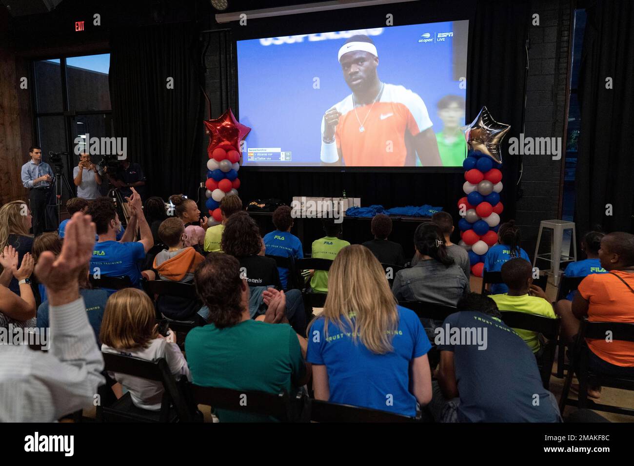 Frances Tiafoe supporters watch television coverage of the U.S
