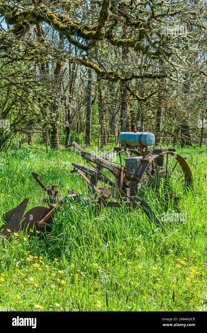 Old rusty deteriorating motorized farm equipment (harrow) at the Dorris