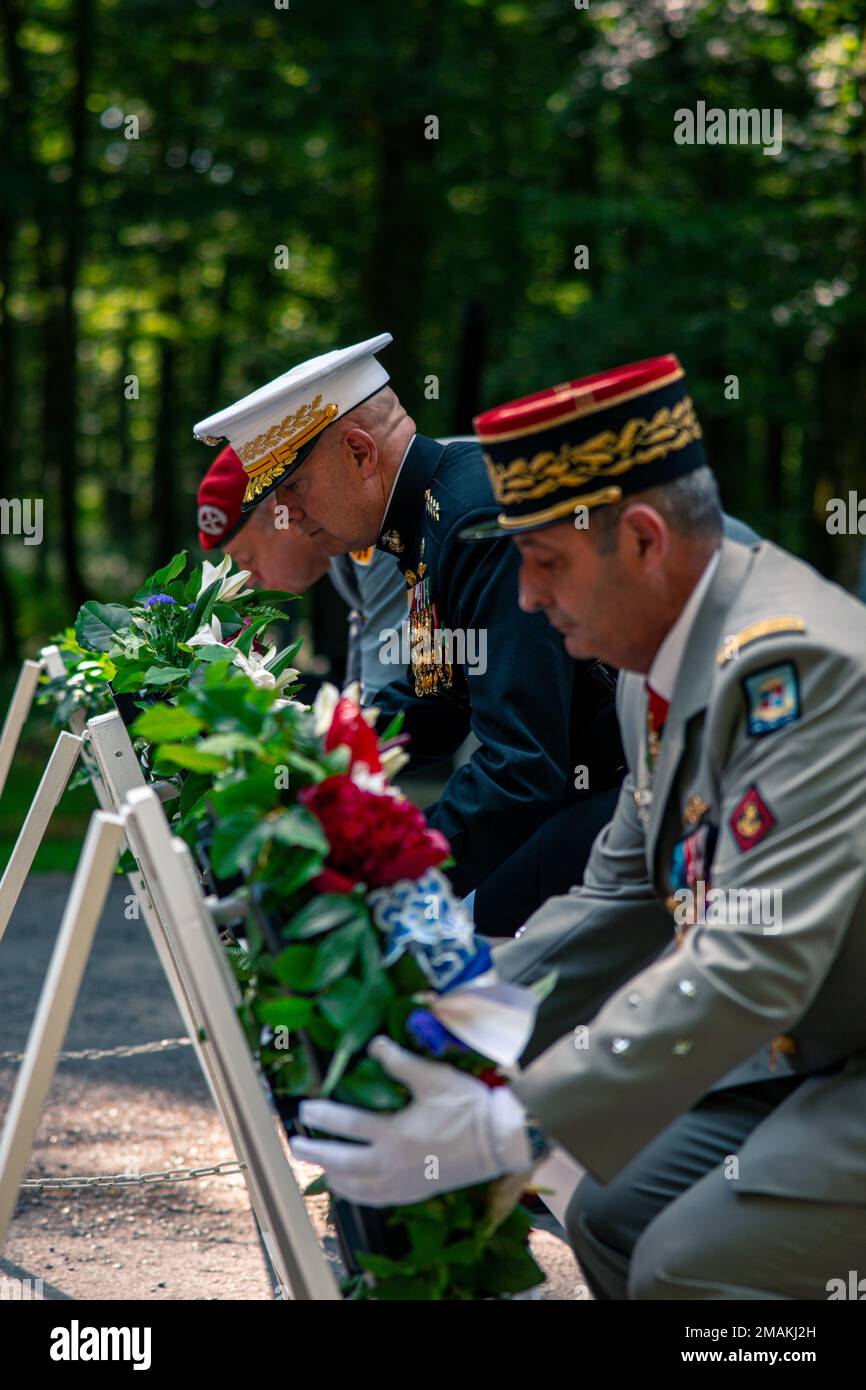 The Commandant of Marine Corps, General David H. Berger, lays a wreath alongside French and German Generals at a private ceremony at Aisne-Marne American Cemetery marking the 104th anniversary of the Battle of Belleau Wood, May 29, 2022. The Battle of Belleau Wood is remembered for the intensity of the fighting and sustained, as well as for the participation of the 5th and 6th Marine Regiments. To this day, Marines assigned to these two regiments wear the French fourragere on the left shoulder of their uniforms as a reminder of their unit's distinguished service during the First World War. Stock Photo