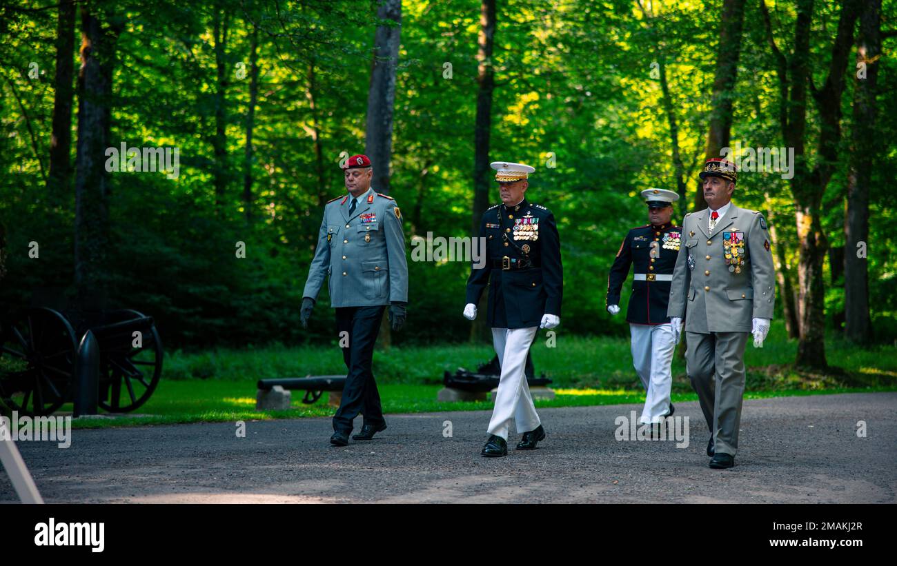 The Commandant of Marine Corps, General David H. Berger, lays a wreath alongside French and German Generals at a private ceremony at Aisne-Marne American Cemetery marking the 104th anniversary of the Battle of Belleau Wood, May 29, 2022. The Battle of Belleau Wood is remembered for the intensity of the fighting and sustained, as well as for the participation of the 5th and 6th Marine Regiments. To this day, Marines assigned to these two regiments wear the French fourragere on the left shoulder of their uniforms as a reminder of their unit's distinguished service during the First World War. Stock Photo