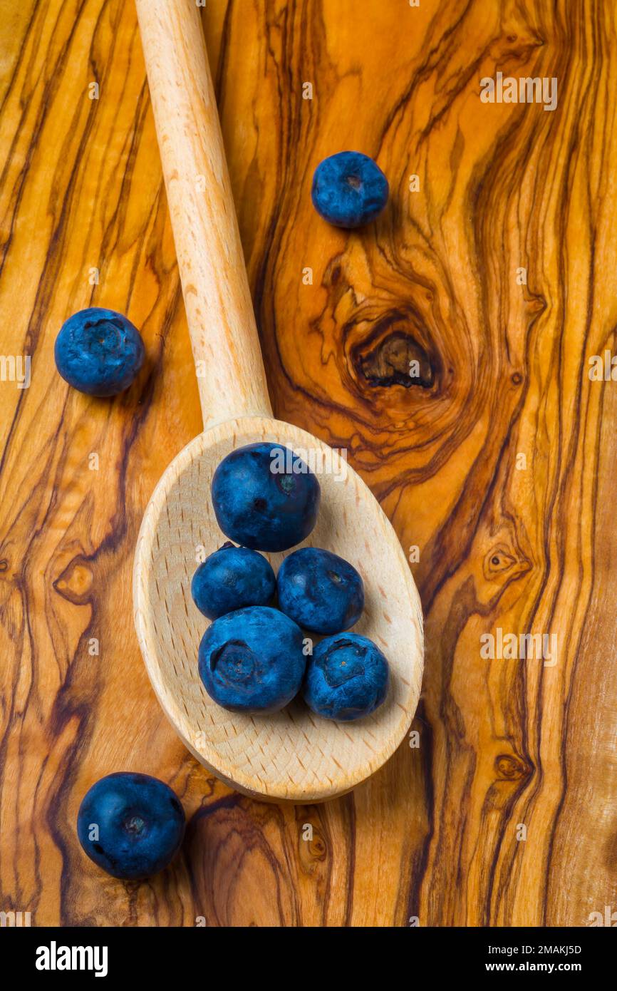 Wooden Spoon And Blueberries Stock Photo