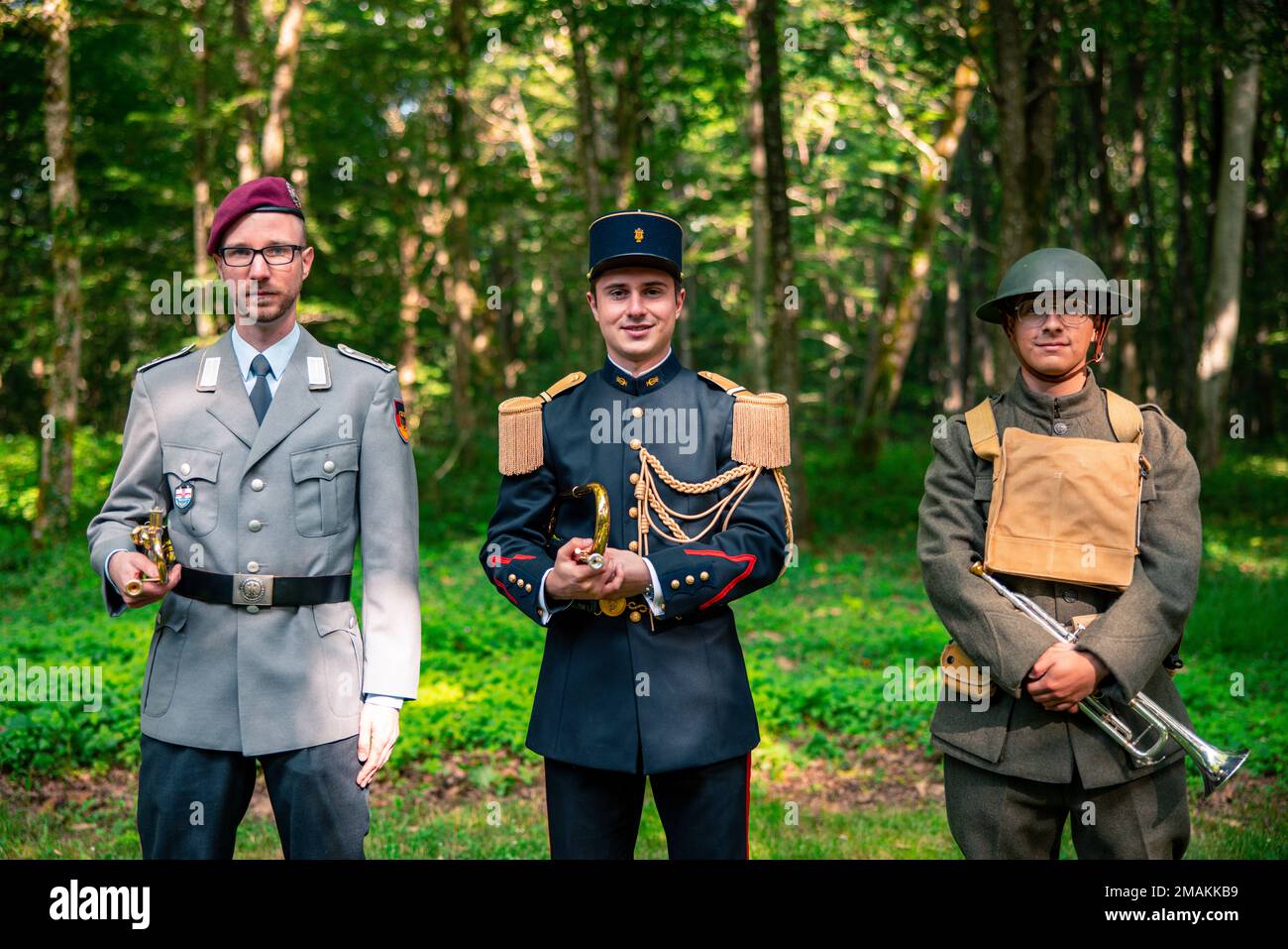 Buglers from France, Germany and the United States pose for a photo at a private ceremony at