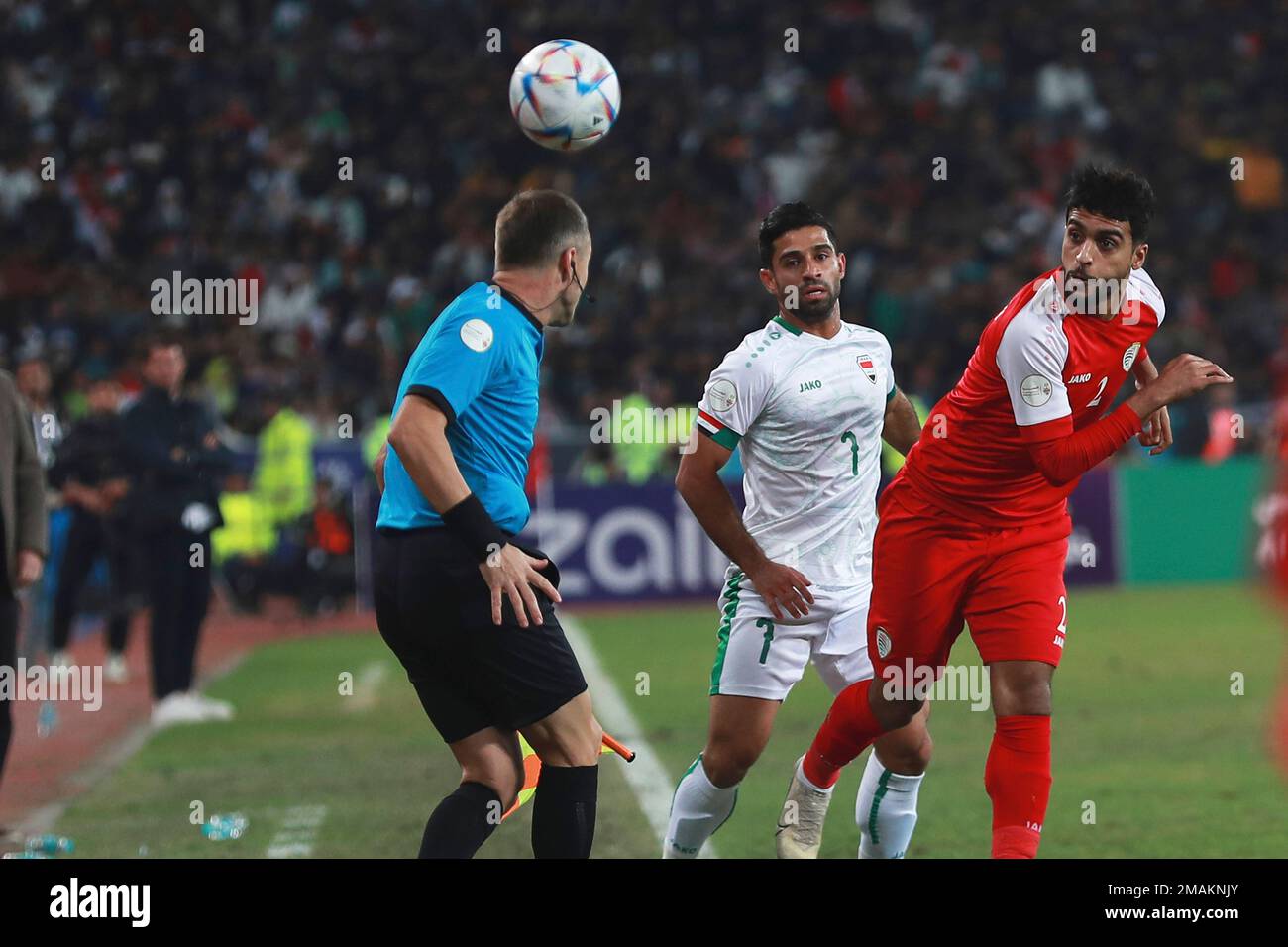 Iraq's Hussein Al Sayed, center, fights for the ball, during the ...