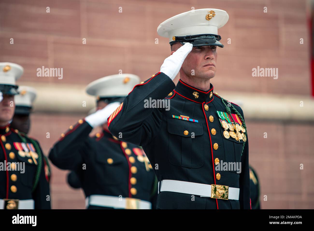 U.S. Marines from 6th Marine Regiment, 2d Marine Division salute at a ...