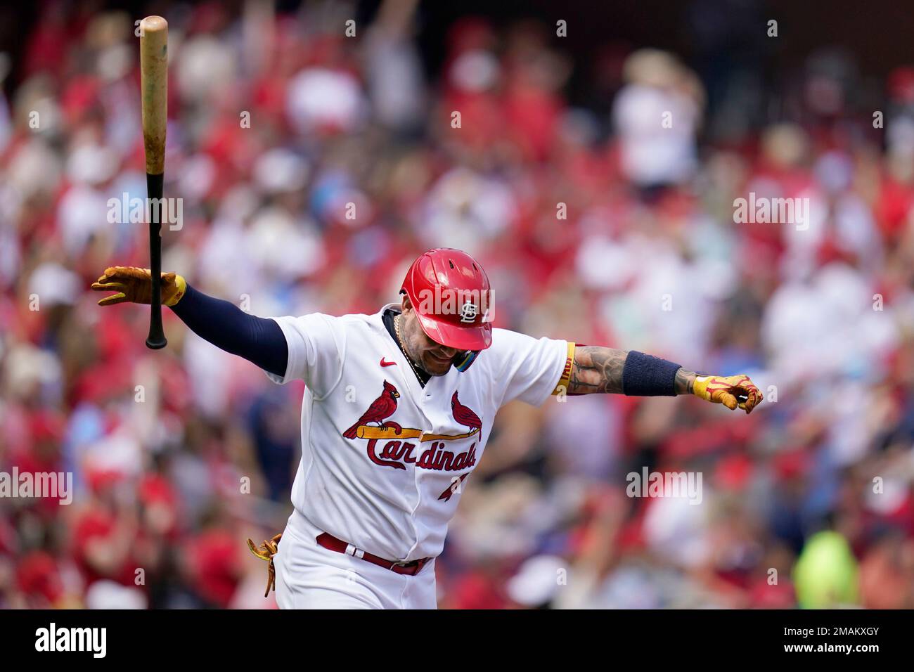 St. Louis Cardinals' Yadier Molina celebrates after hitting a two