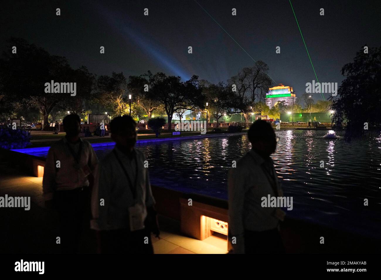 People walk across a newly made bridge over a canal for the revamped ...