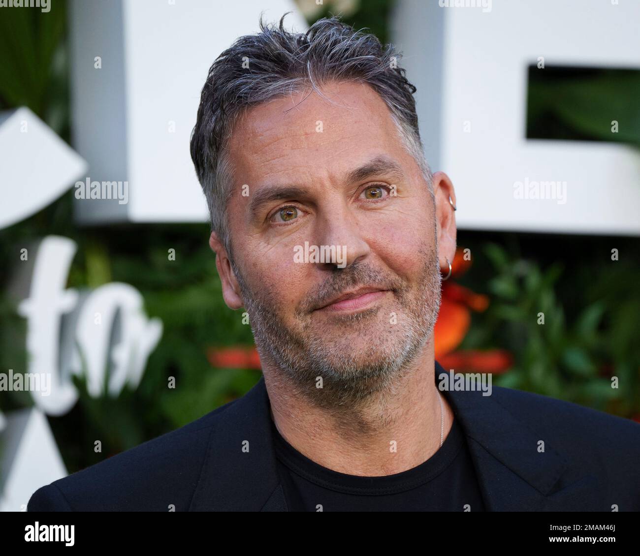 Director Ol Parker poses for photographers upon arrival for the World