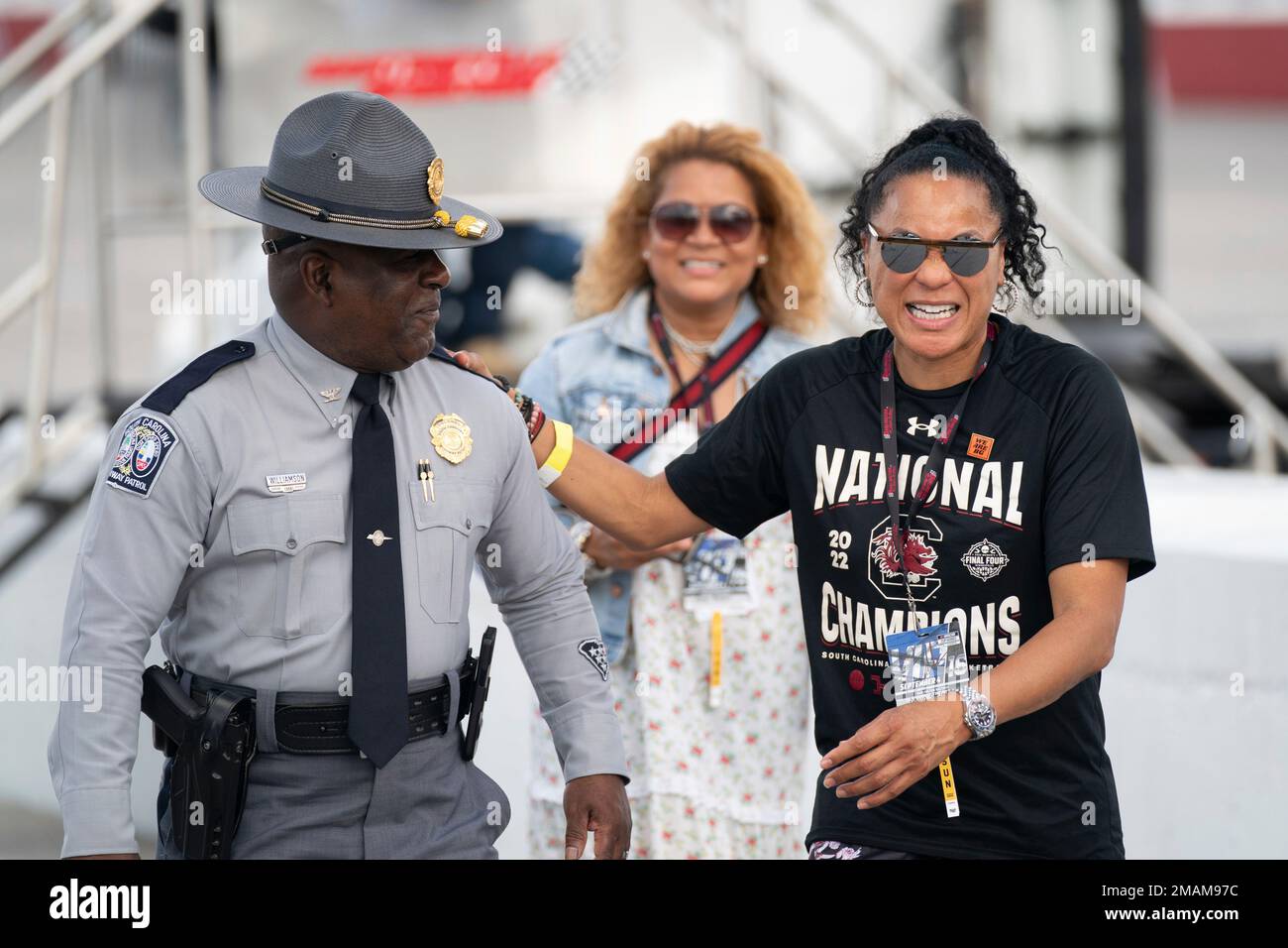 University of South Carolina women's basketball coach Dawn Staley, right,  shares a laugh with Col. Christopher Williamson, commander of the South  Carolina Highway Patrol, before the NASCAR Southern 500 auto race Sunday,
