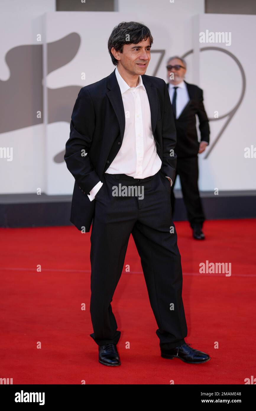 Luigi Lo Cascio poses for photographers upon arrival at the premiere of