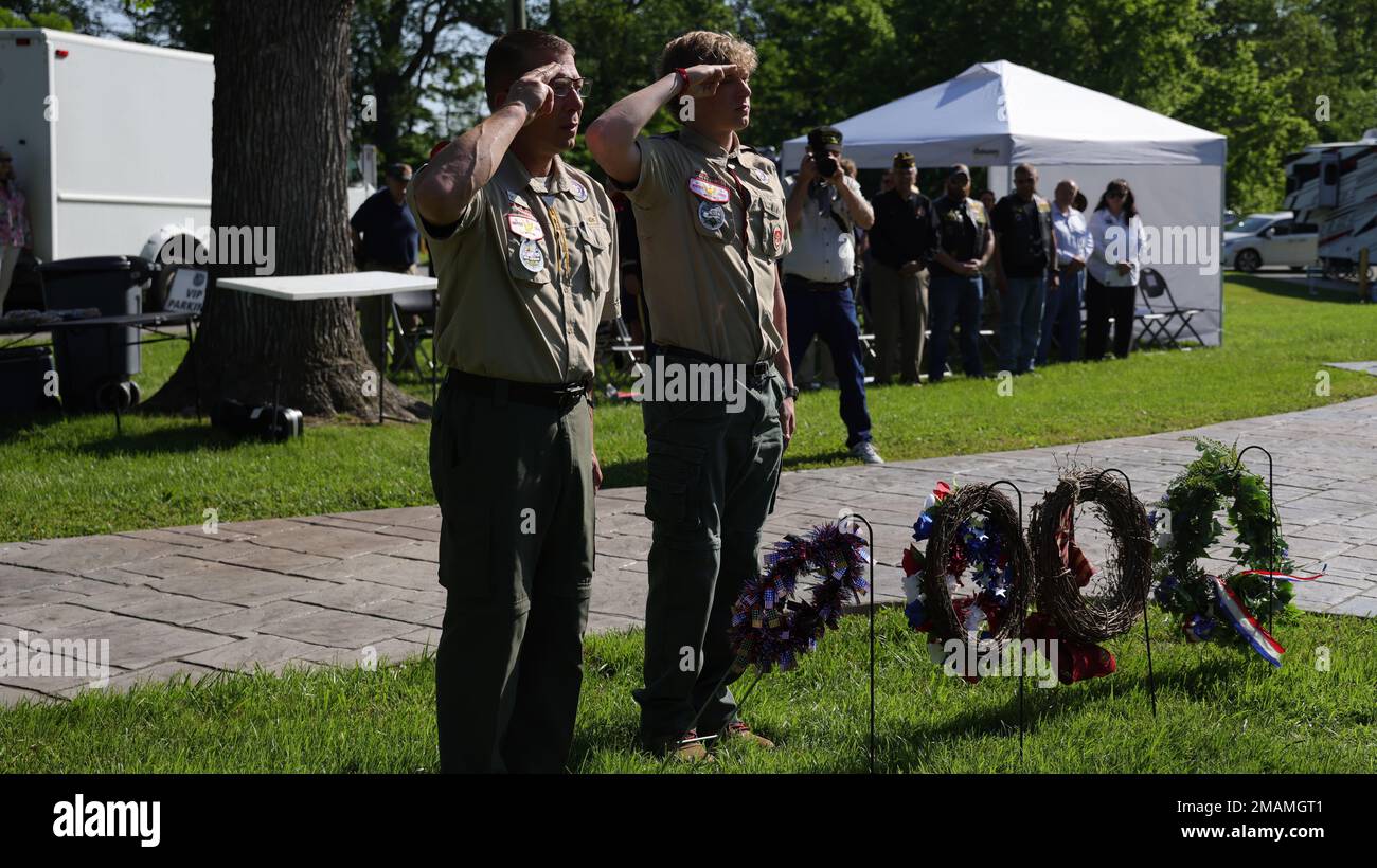 Vince Dattoli, Scoutmaster, and Chris Dattoli, Life Scout, with Boy Scouts of America, Troop 564 based in Bel Air, Maryland, render salutes during a Memorial Day Tribute ceremony held May 30 at the post cemetery on Aberdeen Proving Ground (North), Maryland.  Memorial Day is an American holiday, observed on the last Monday of May, honoring the men and women who died while serving in the U.S. military. Stock Photo