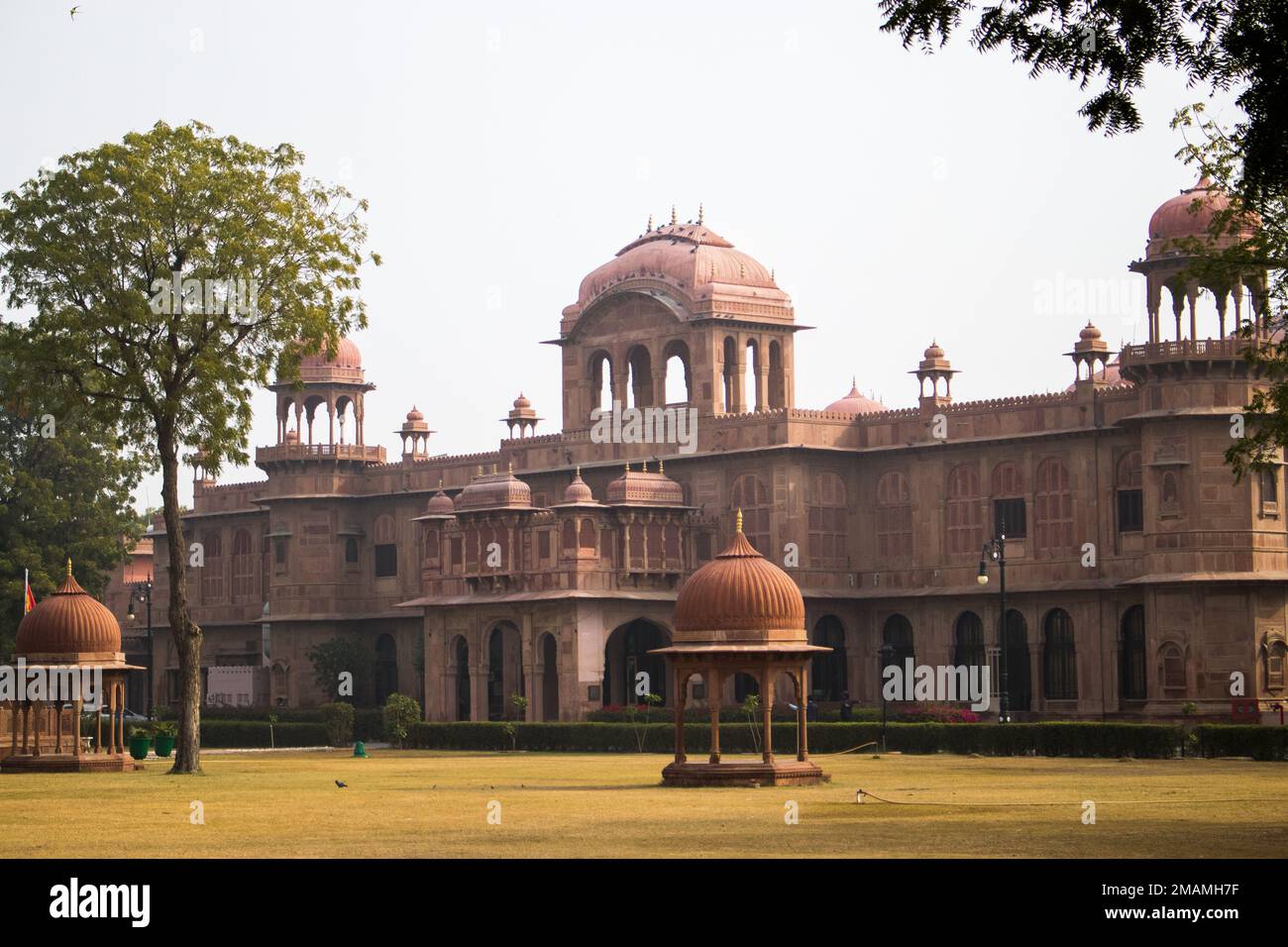 The historical Lalgarh Palace in Bikaner India with a grass park in front Stock Photo