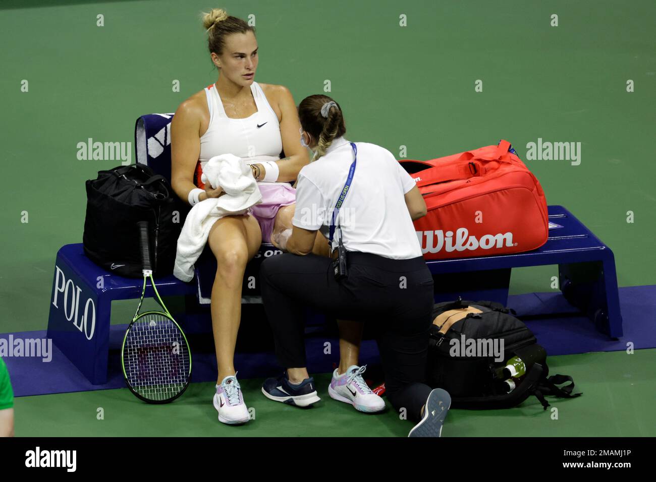Aryna Sabalenka, of Belarus, is attended to during her match against