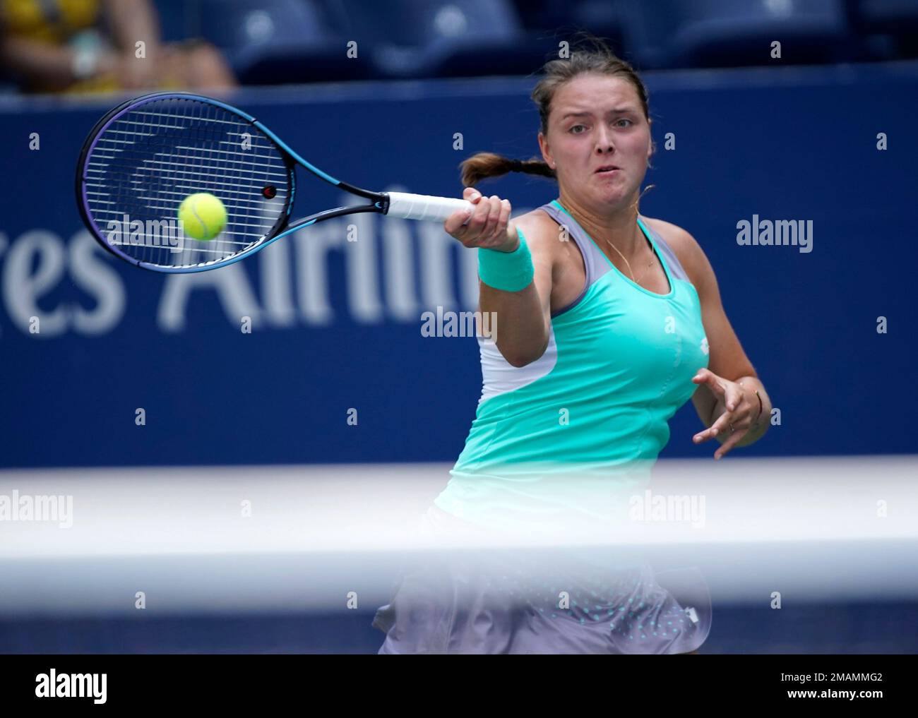 Jule Niemeier, of Germany returns to Iga Swiatek, of Poland, during the fourth round of the U.S. Open tennis championships, Monday, Sept