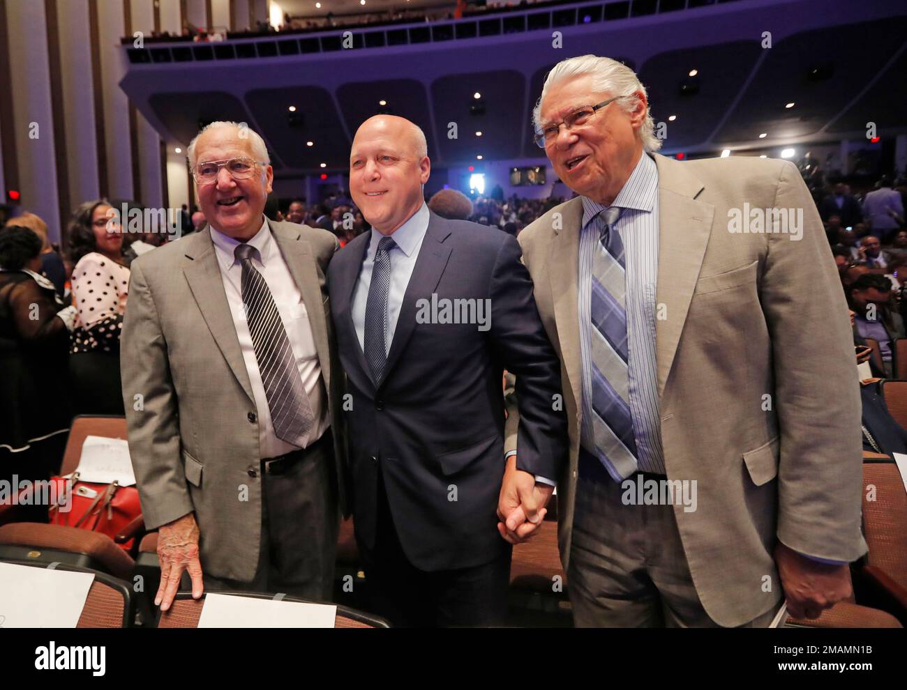 FILE Outgoing New Orleans Mayor Mitch Landrieu, center, poses for a