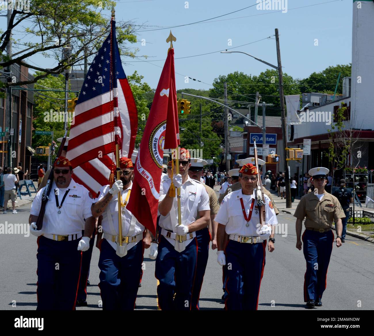 NEW YORK(MAY 30,2022) U.S. Marine Corps veterans from the Staten Island Marine Corps League Detachment 264 lead active duty Marines of the Medium Tiltrotor Squadron (VMM) 162 unit assigned to the amphibious assault ship USS Bataan (LHD 5), participate in a Memorial Day Parade through a Staten Island community during Fleet Week. Fleet Week New York, now in its 34th year, is the city’s time-honored celebration of the sea services. It is an unparalleled opportunity for the citizens of New York and the surrounding tri-state area to meet Sailors, Marines and Coast Guardsmen, and witness firsthand t Stock Photo