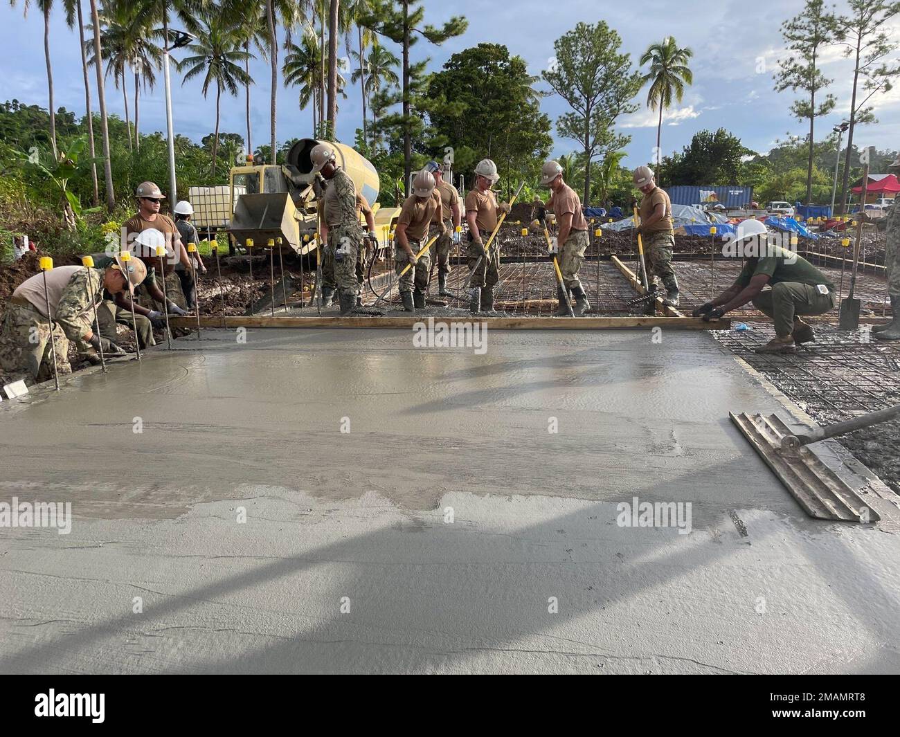 SAVUSAVU, Republic of Fiji (May 30, 2022) — U.S. Navy Seabees assigned to Naval Mobile Construction Battalion 3 (NMCB-3), alongside Army Engineers from the Republic of Fiji Military Forces, construct a concrete pad in support of a Pacific Partnership 2022 engineering primary school engineering project. Now in its 17th year, Pacific Partnership is the largest annual multinational humanitarian assistance and disaster relief preparedness mission conducted in the Indo-Pacific. Stock Photo