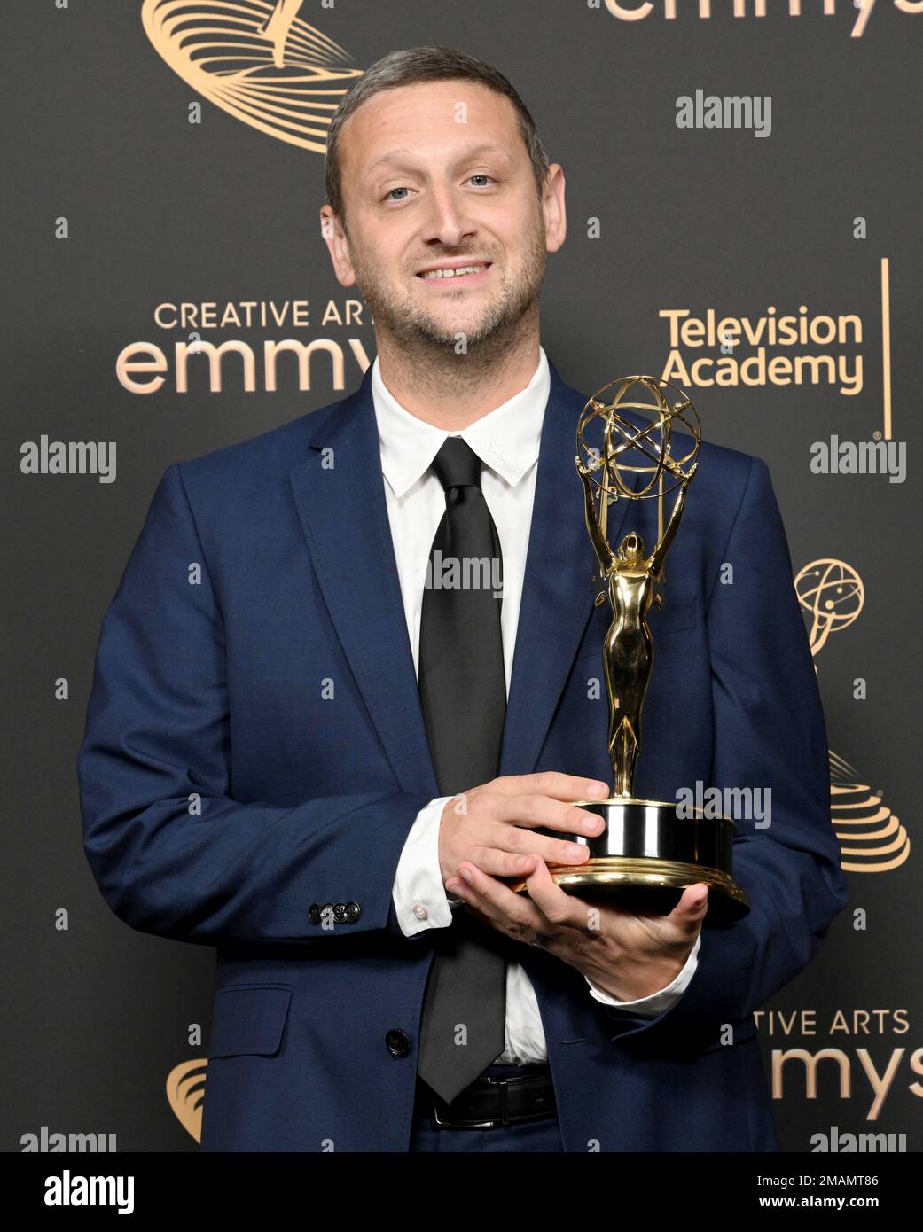 Tim Robinson poses with the Emmy for outstanding actor in a short 