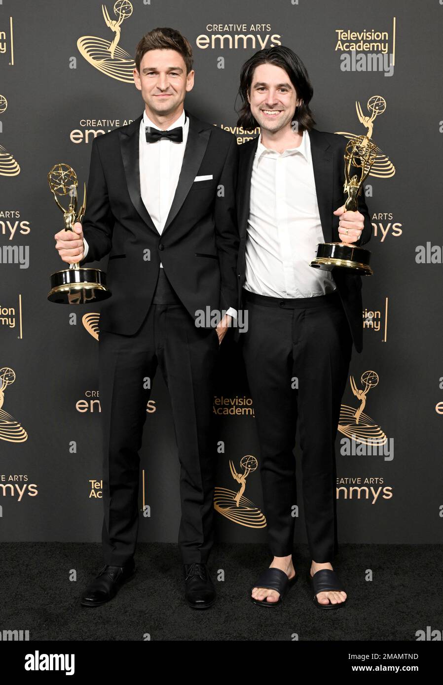 Oliver Latta, left, and Teddy Banks pose with the Emmy for outstanding ...