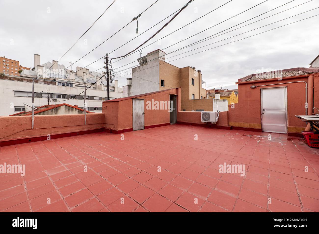 Terrace in the attic of a building with some ropes to hang clothes and ...