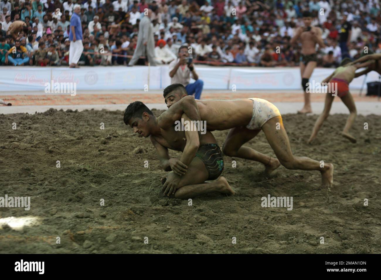 Pakistani Kushti wrestlers participate in a Shahi Dangal competition ...