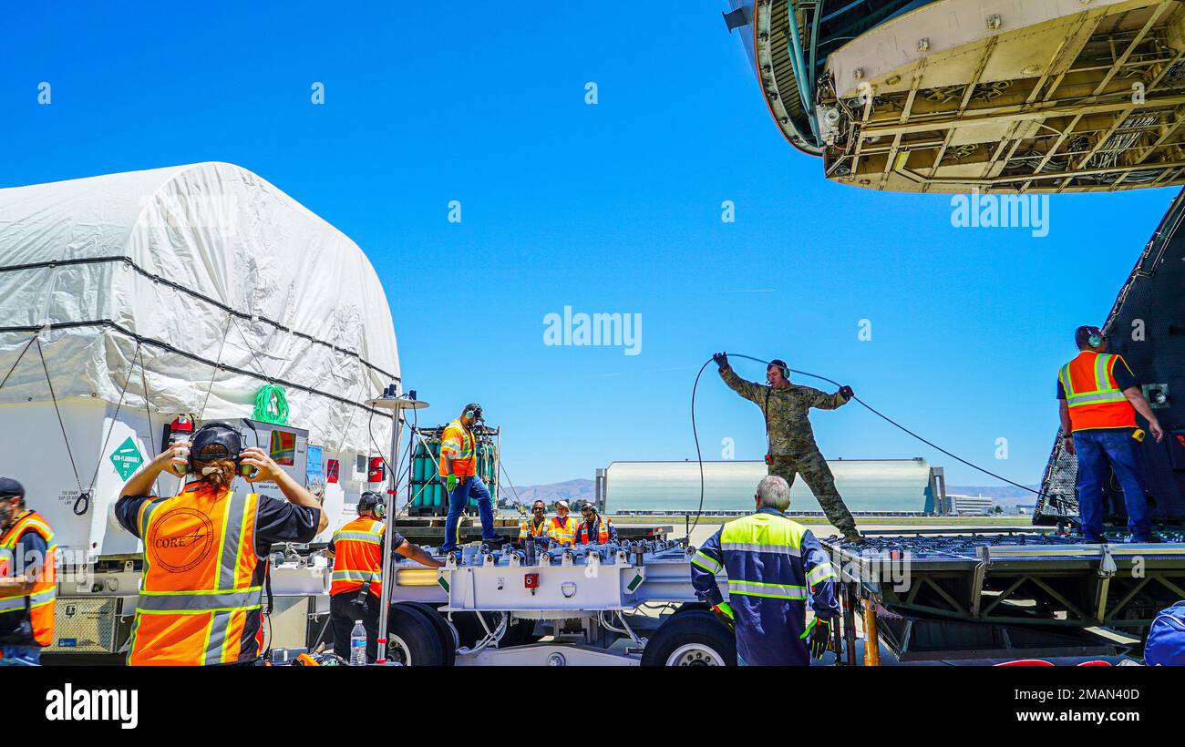 Loadmasters from the 60th Air Mobility Wing and Lockheed Martin Space load the sixth Geosynchronous Earth Orbit Space Based Infrared System satellite (SBIRS GEO-6) into a C-5M Super Galaxy aircraft at Moffett Federal Airfield, Calif., May 31, 2022. The satellite was taken to a processing facility to undergo testing and fueling prior to encapsulation. GEO-6 is expected to launch in July 2022 and is the last SBIRS program launch. Stock Photo