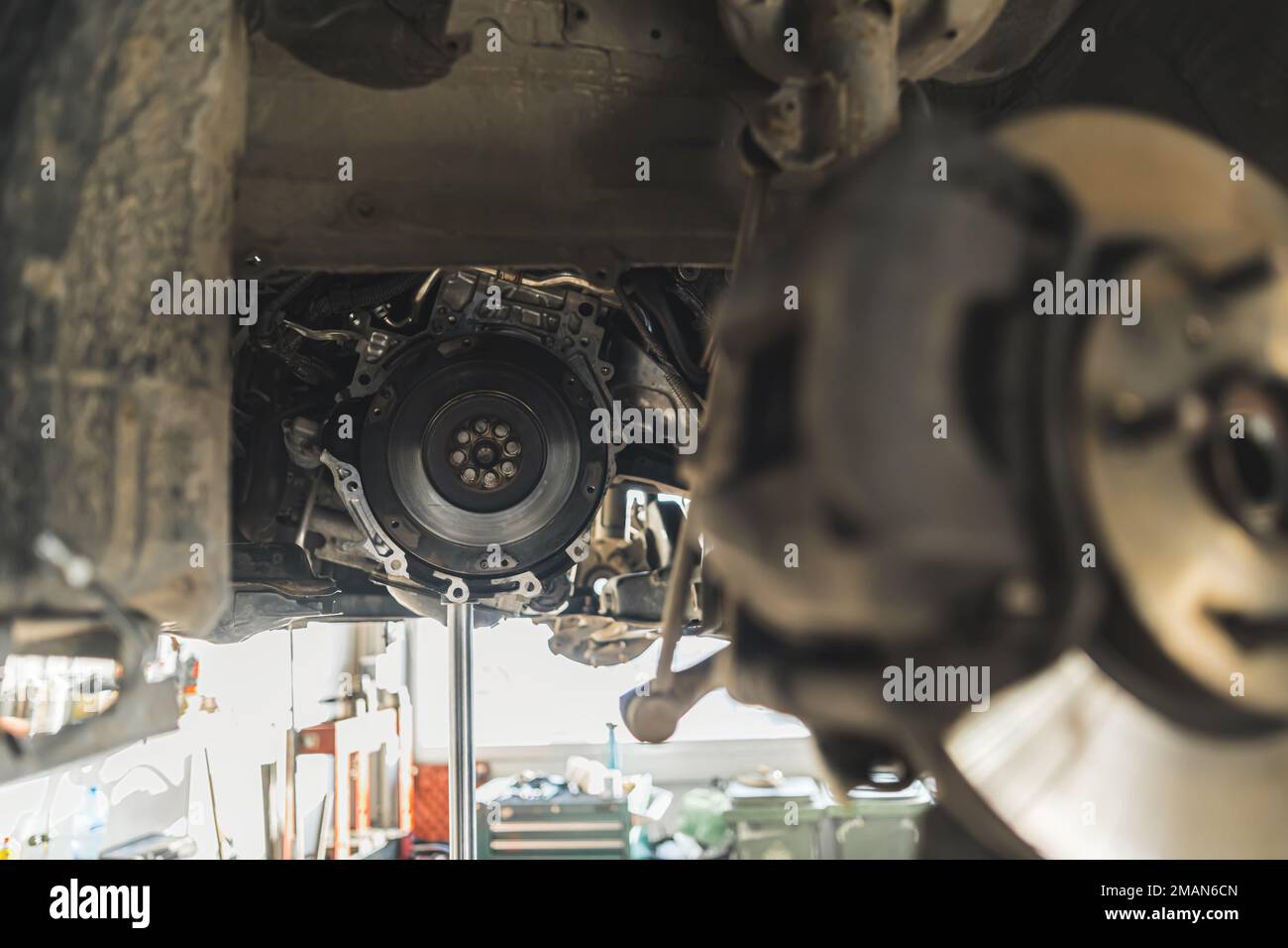 Close-up of replacement of the flywheel and clutch of a car in auto repair shop. High quality photo Stock Photo