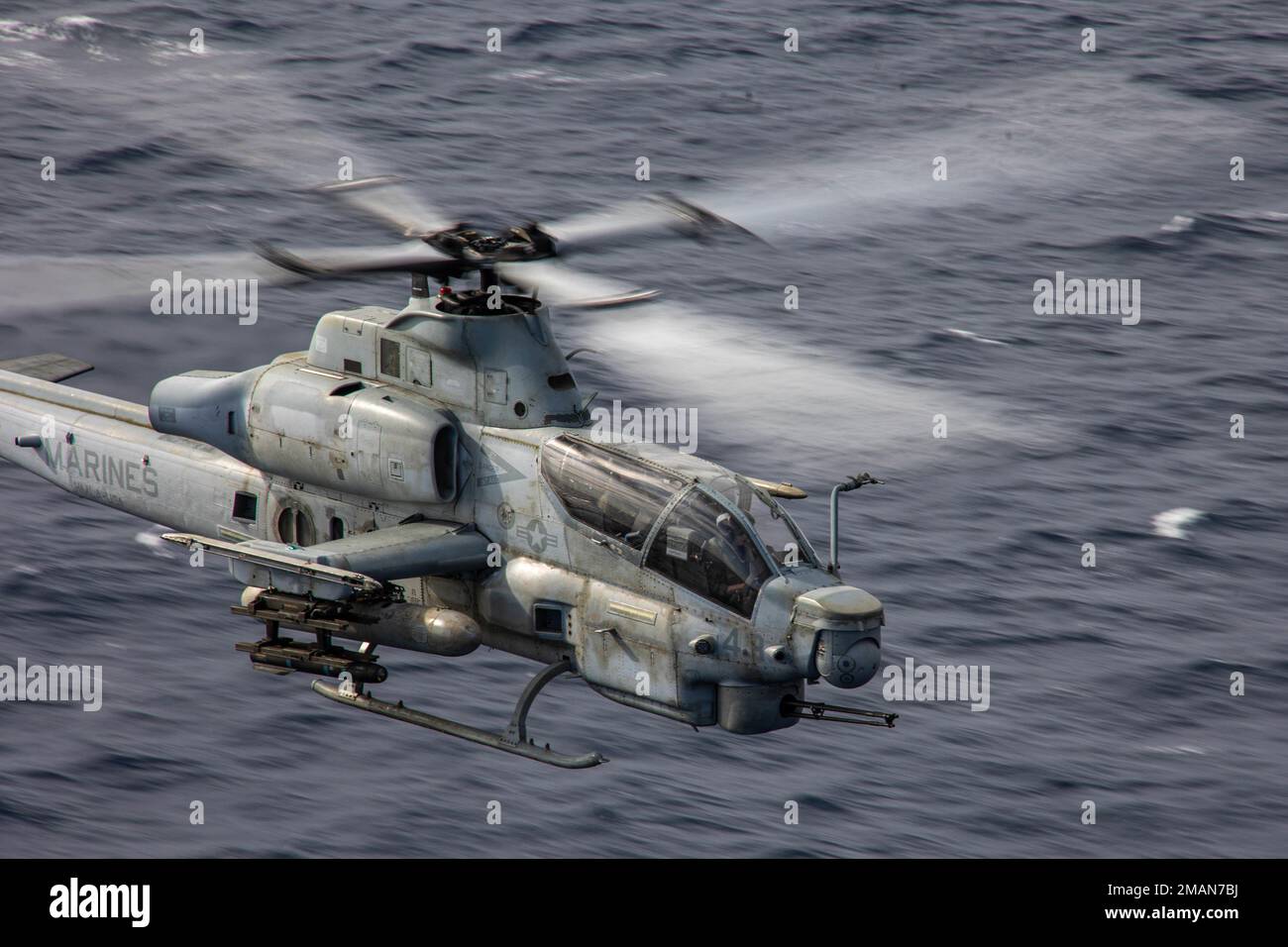 U.S. Marines with Marine Medium Tiltrotor Squadron (VMM) 262 (Rein.), 31st Marine Expeditionary Unit, pilot an AH-1Z Viper helicopter during a live-fire exercise off the coast of Okinawa, Japan, Oct. 26, 2022. Katana Strike is led by III Marine Expeditionary Force's Information Group, designed to demonstrate proficiency in coalition joint-force planning, coordination, and execution of dynamic targeting in a maritime environment; the exercise showcases 5th Air Naval Gunfire Liaison Company’s role as the central hub for conducting long-range communications between joint ground, naval and aviatio Stock Photo