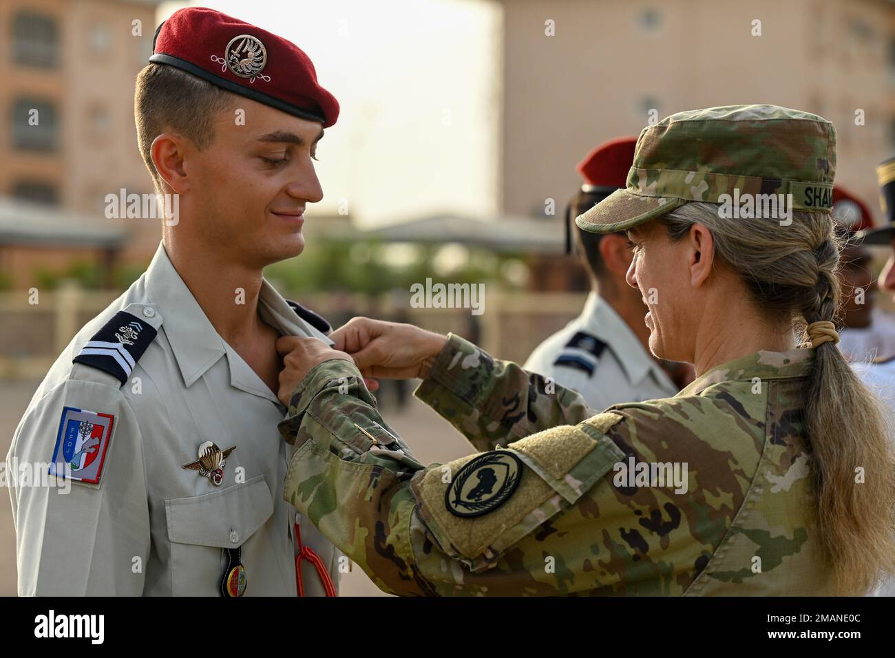 U.S. Army Maj. Gen. Jami Shawley, commanding general of Combined Joint Task Force - Horn of Africa (CJTF-HOA), pins a desert commando badge on a French Soldier during a French Desert Commando Course graduation ceremony at the 5th Overseas Interarms Regiment, Djibouti, June 1, 2022. Members of the CJTF-HOA regularly train and work alongside allies, partners, and government organizations to achieve a unified effort to improve safety, security and prosperity in East Africa. Stock Photo