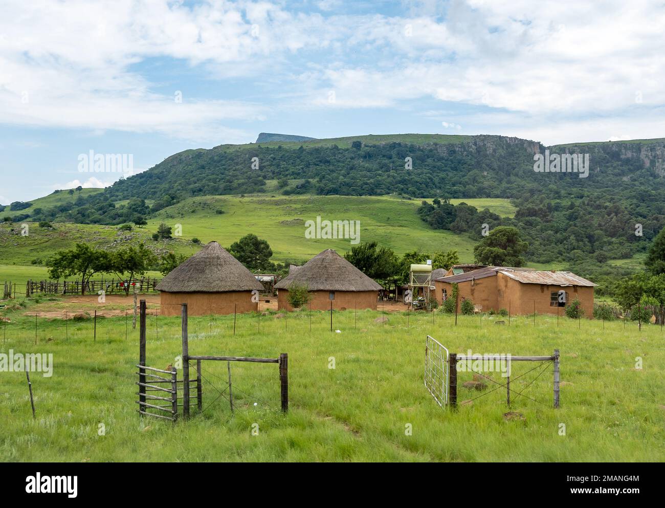 Traditional round mud houses in a Zulu village. Wakkerstroom,  South Africa. Stock Photo