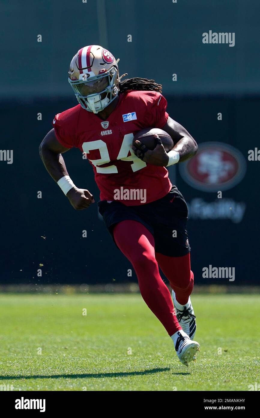 San Francisco 49ers' Jordan Mason takes part in drills at the NFL 