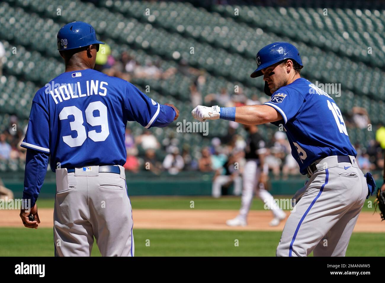 Kansas City Royals first base coach Damon Hollins (39) and Michael